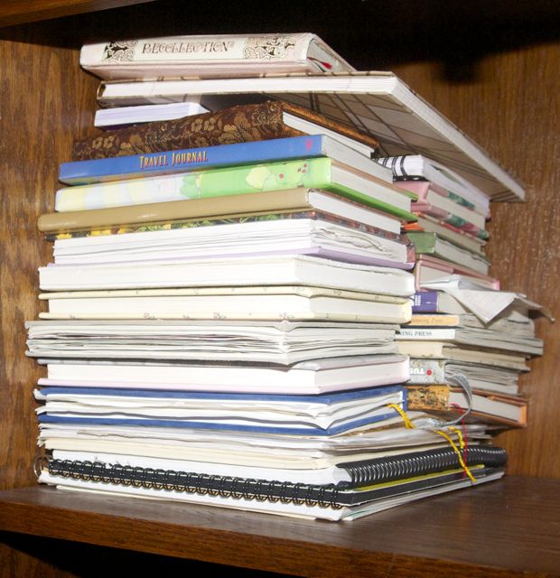 A stack of personal journals, two deep.