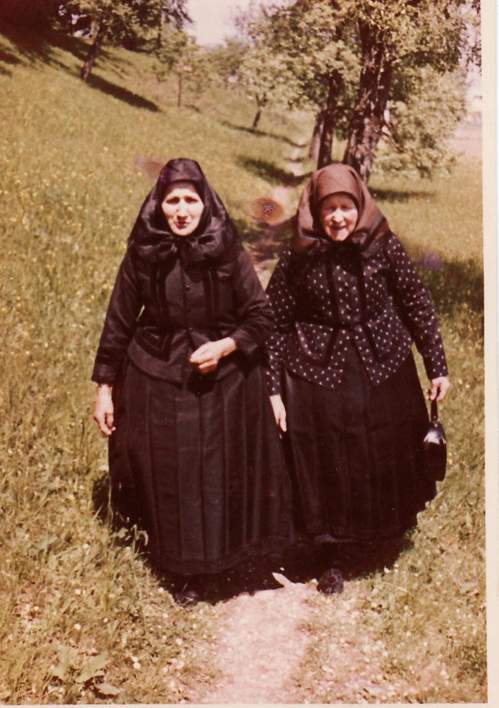 Two women from Schoendorf, Romania, dressed all in black, their traditional Sunday clothes.