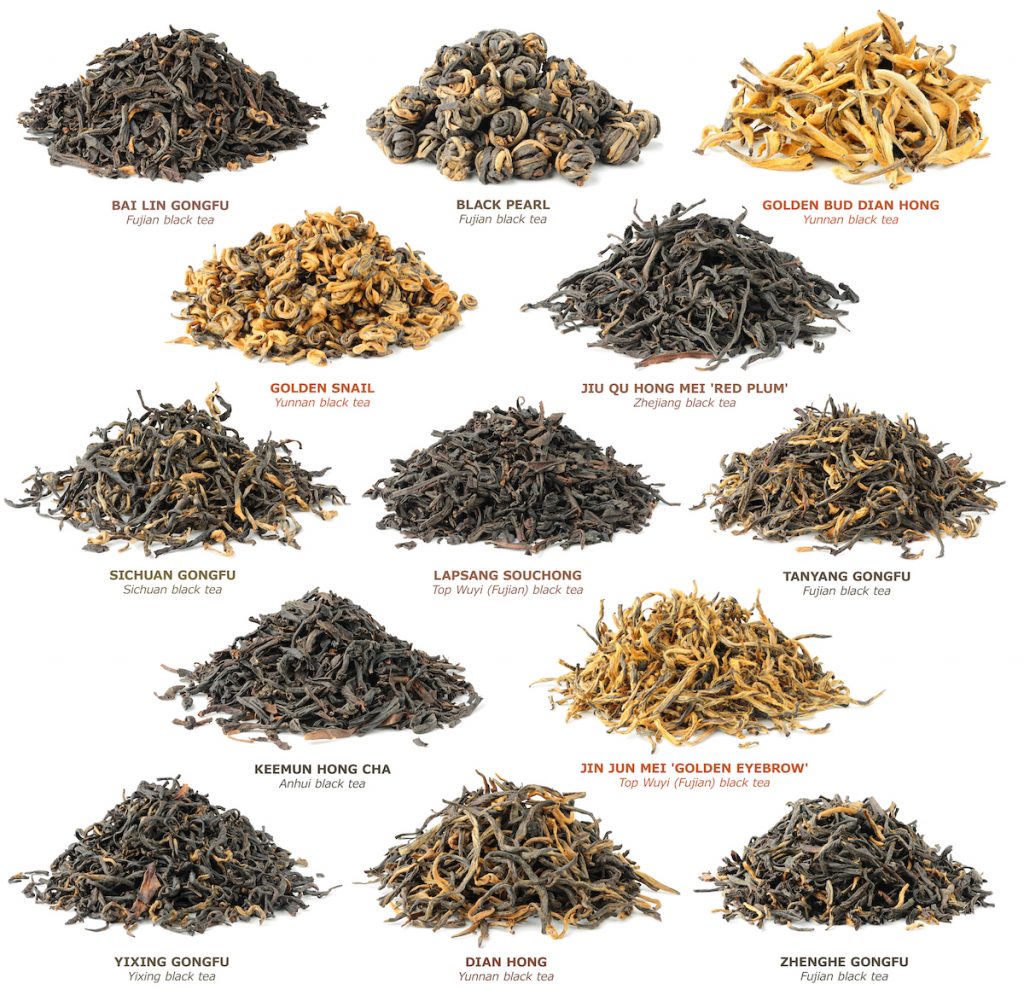 Piles of different types of black tea leaves