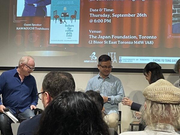 Toshikazu Kawaguchi on the stage at the Japan Foundation in Toronto, getting ready for his talk.